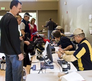 Kiwanian Warren Huckabay mans the cashiers table at the very popular 2008 ski and sport swap.