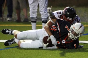 Eastside Catholic's Alec Kimble celebrates on the ground after catching a 9-yard touchdown pass from Connor McCormick in the second quarter.