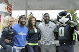 Former Seattle Seahawks cornerback Marcus Trufant (second from right) celebrated Blue Friday with Sammamish residents on Sept. 23 at the Shell gas station on 228th Avenue Southeast.