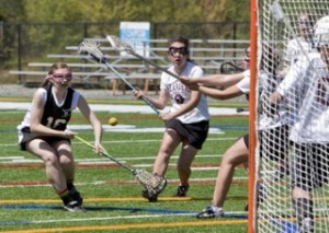 Issaquah's Meaghan Stratford battles for a loose ball in front of the Mercer Island net on Saturday afternoon.