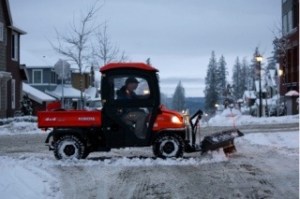 Employees of the Issaquah Highlands Community Association clear the streets on the weekend
