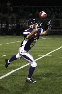 Issaquah wide receiver Evan Peterson reels in a Ryan Bergman pass Friday night against Eastlake.
