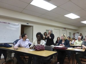 Robin Avni speaks at the meeting