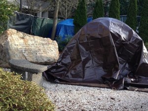One of the tents in Tent City 4 sits next to scripture.