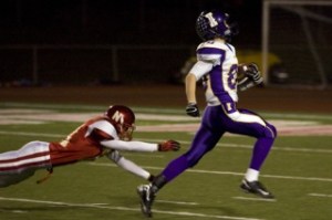 Issaquah sophomore wide receiver Evan Peterson breaks away from the Newport defense for a 69-yard gain Friday night. Peterson had five catches for 131 yards and two touchdowns