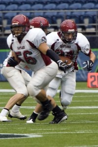 Eastlake’s Stephen Nasca takes a handoff at Qwest Field Saturday afternoon.