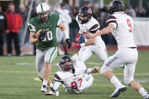 Skyline's Caleb Johnston eludes a bevy of Camas defenders. Skyline defeated Camas 35-10 in the Class 4A quarterfinals on Nov. 21 in Sammamish.