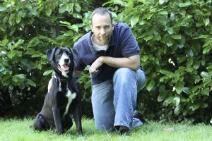 PetHub founder Tom Arnold poses with 18-month-old Ullr