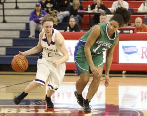 Issaquah's Blaire Brady pushes the ball upcourt Tuesday afternoon against Woodinville's Ali Forde.