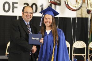 Jaimey Hayes receives her diploma from Jeff Bush