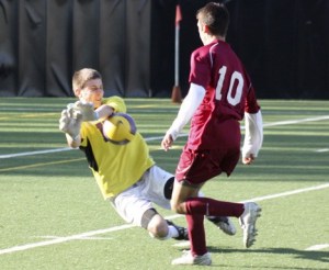 Issaquah goalkeeper Evan King blocks a shot from Eastlake's Renato Bandeira Tuesday night at Seattle's Memorial Stadium.