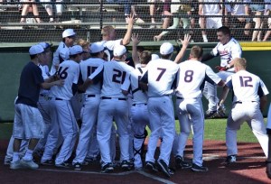 Jeff Bohling is greeted at the plate by teammates after his walk-off home run in the Metro League title game.