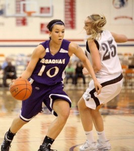 Issaquah’s Maddey Pflaumer drives past Eastlake’s Alyssa Charlston in a Feb. 25 loser-out KingCo playoff game. On Wednesday