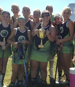 Members of the Superstix lacrosse team celebrate their tournament title