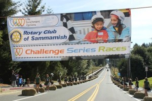 Soapbox-derby-style cars race down Southeast 224th Street.