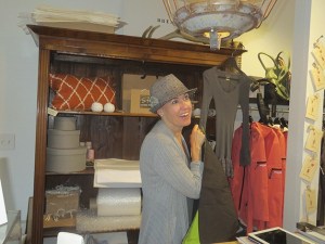 Splendid Avenue owner Monika Claassen enjoys a customer while taking care of his purchase.