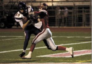 Issaquah’s Evan Peterson snags one of his five catches Friday night. The sophomore had 131 yards receiving and two TDs.