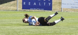 Sammamish’s Abby Goax dives for a ball in centerfield Tuesday afternoon during the Junior Softball World Series at Everest Park in Kirkland.