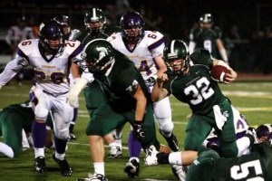 Skyline's Nick Washburn follows blocker Jack Carlson. Washburn carried the ball 18 times for 168 yards in the Spartan's 42-0 win over Issaquah.