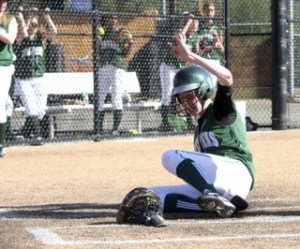 Skyline’s Emily Baer slides safely across home plate in the second inning
