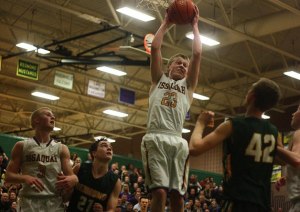 Issaquah's Scott Kellum corrals a rebound against Redmond. The Eagles defeated the Redmond Mustangs 84-54 on Feb. 21 at Redmond High School.