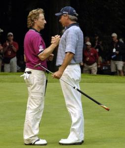 Fred Couples congratulates Bernhard Langer after winning the U.S. Senior Open at Sahalee on Aug. 1. The duo