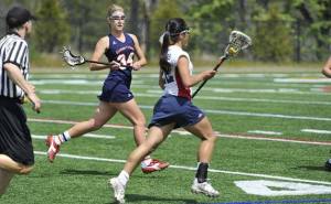Alex Foreman checks a Kennedy player during the Division II State Title game in 2010