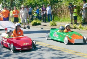 And they're off! Two cars race down Second Avenue in each heat of the Challenge Race.