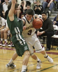 Eastlake's Dillon Pericin drives on Skyline's Will Parker.