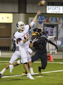 Eastside Catholic Crusaders senior quarterback Harley Kirsch throws a pass down the field in the Class 3A state championship game against the Bellevue Wolverines on Dec. 4 at the Tacoma Dome