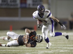 Issaquah wide receiver Ross Zuhl escapes the grasp of Central Kitsap's Howie McDonald for a first down.