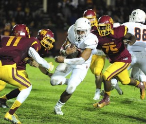 Eastside Catholic running back Brandon Wellington gains a significant amount of yards on a carry against the O'Dea Fighting Irish on Oct. 17 in West Seattle.