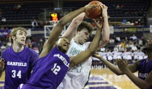 Skyline's Cory Hutsen battles for a loose ball with Garfield's Daeshaun Hall (12).