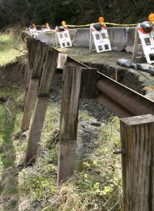 A landslide on Mountainside Drive threatens the utility lines going up to the Forest Rim neighborhood.