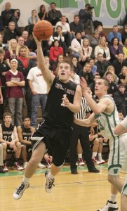 Conner Iarola goes up for a shot Tuesday night in the final seconds of regulation against Woodinville. The Wolves were unable to convert