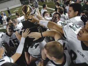 Skyline football players celebrate winning the 4A state championship