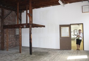 artEAST Executive Director Karen Abel stands in the organizations new building on Front Street before it was remodeled.