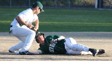 Skyline shortstop Wes Blackburn tags out Redmond's Patrick McGrath