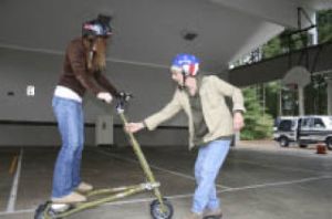 Eleventh-grader Marissa Perfect gets a helping hand getting her TRIKKE started from Larry Santos.