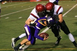Issaquah's Braden Bouwman is swarmed by Eastlake's Bryan Cassil