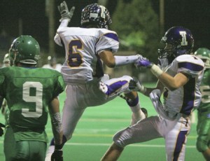 Adam Dondoyano (6) celebrates with Mitchell Bair Friday night after Bair grabbed a 33-yard pass for a touchdown.