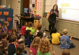 Music teacher Alice Badgley makes a sign for her 'quiet coyote' to show the kids when not to beat their sticks. She was one of 31 teachers in the Issaquah School District to receive National Board Certification.