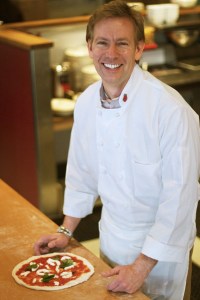 Joe Fugere with a freshly made pizza.