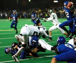 Skyline kick returner Evan Zeger gets the ball jarred loose Thursday night. It was one of four Spartan fumbles.