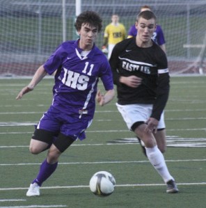 Issaquah's Nick Smith battles with Eastlake's Sawyer Preston Tuesday night in Sammamish.