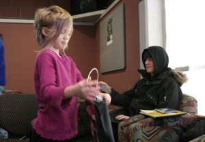 Audry Sammons packs up a laptop in the lobby of the Issaquah Community Center. A Red Cross Shelter was allowing residents charge their electronics in the lobby.