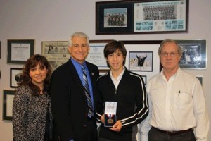 U.S. Rep. Dave Reichert (center left) stands with award winner Ivan Leniski (center right) and parents Susana (far left) and Jason (far right) Jan. 15 on Mercer Island.