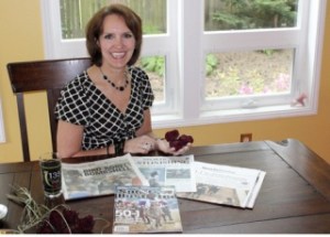 Serena Blach holds three roses her father gave her from the Mine That Bird’s garland after he won the Kentucky Derby on May 2. Blach also has a lock of the horse’s hair and a pair of muddy shoes to remember the event by.