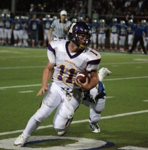 Issaquah quarterback Ethan Kalin breaks away from the Liberty defense Friday night. The junior had 15 carries for 110 yards and one touchdown