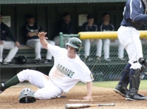 Lakeside's Mike Paulson slides safely into home Tuesday night to give his team a 1-0 lead over Taylor. The Issaquah senior was 3-for-3 at the plate with a run scored and a stolen base.